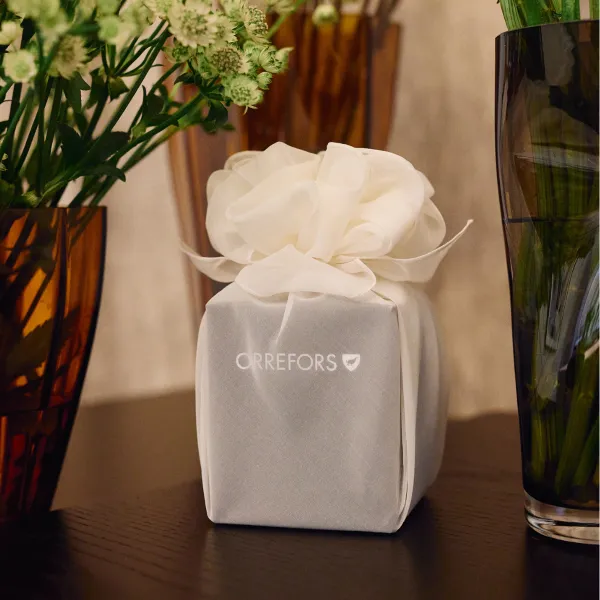 An Orrefors gift wrapped using STUDIO INIIT's design and fabrics
