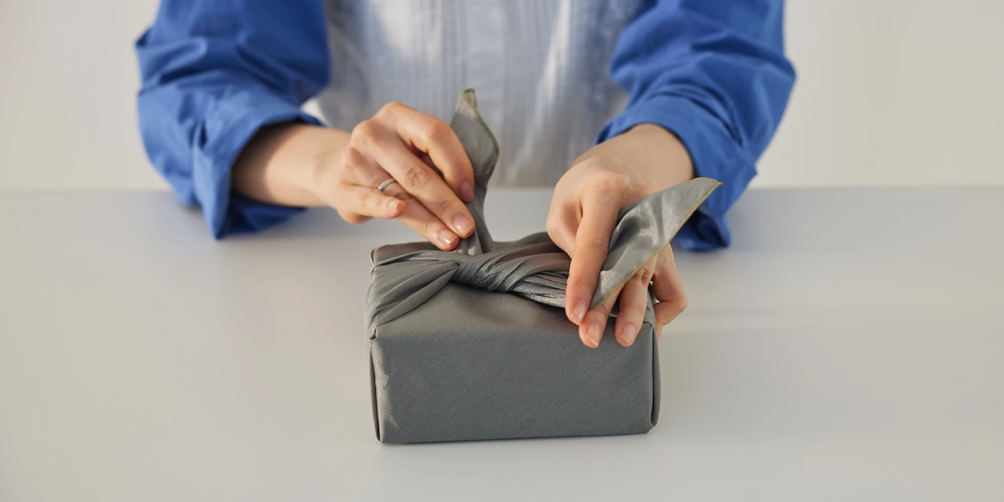A person wrapping a gift