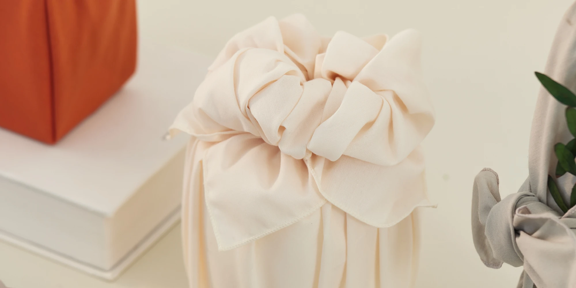 Textile-wrapped gifts in multiple colors, beautifully presented